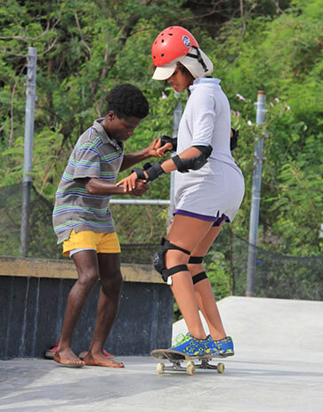 Kids teaching each other at the Freedom Skatepark, Jamaica