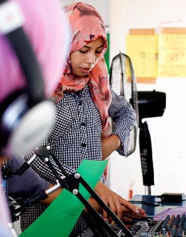Girl doing radio in Jordan