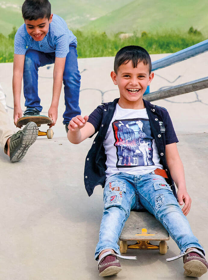 Kids in Iraq on a skateboard