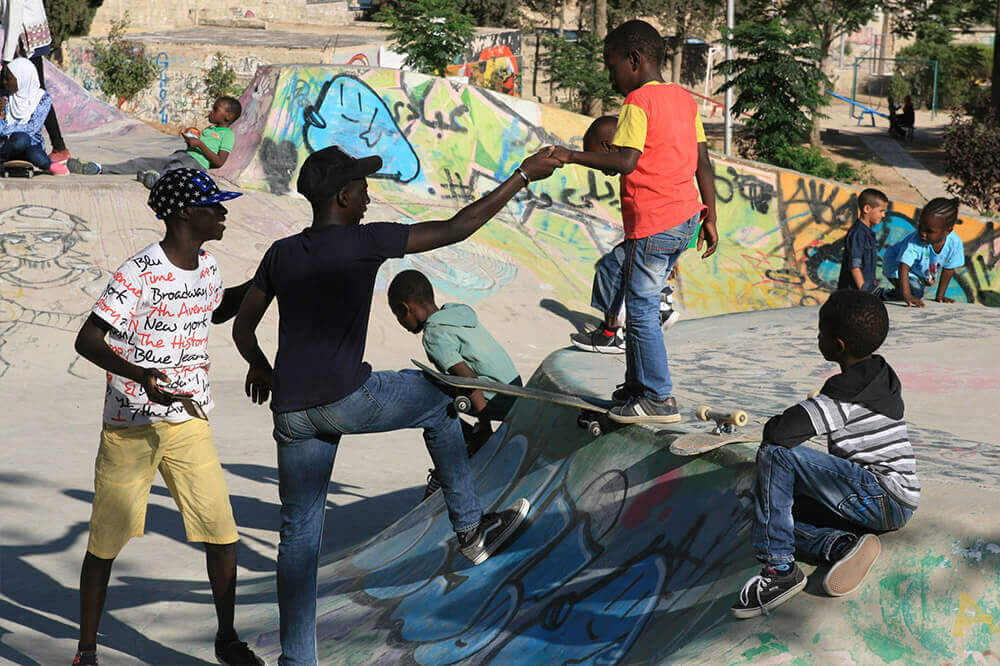 Kids in Jordan helping each other to skate
