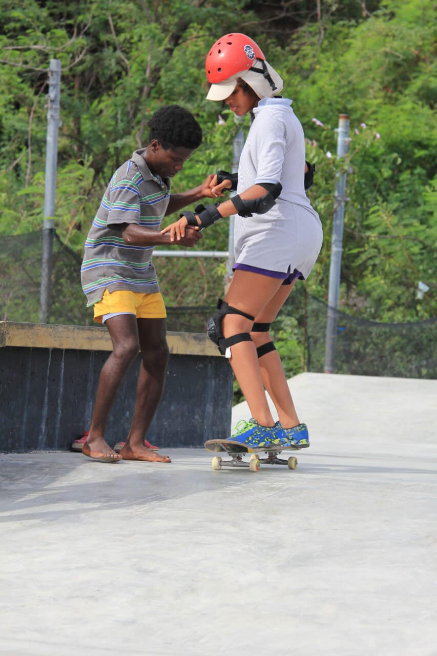 Children teaching each other at the Freedom Skatepark in Jamaica