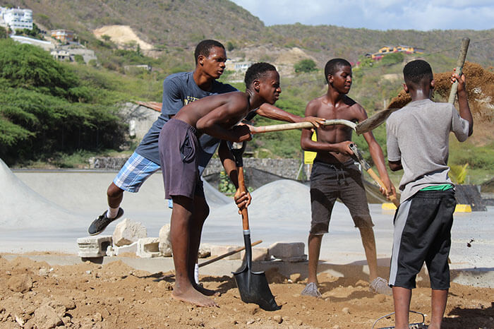 Children moving dirt at the Freedom Skatepark in Jamaica