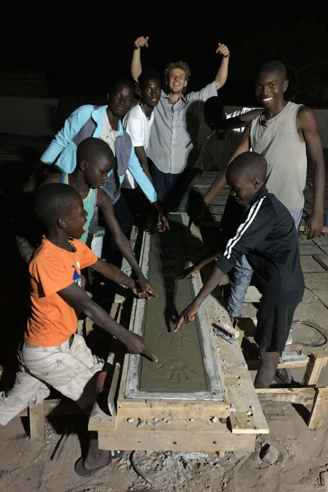 Zambian children helping building the skatepark in Zambia