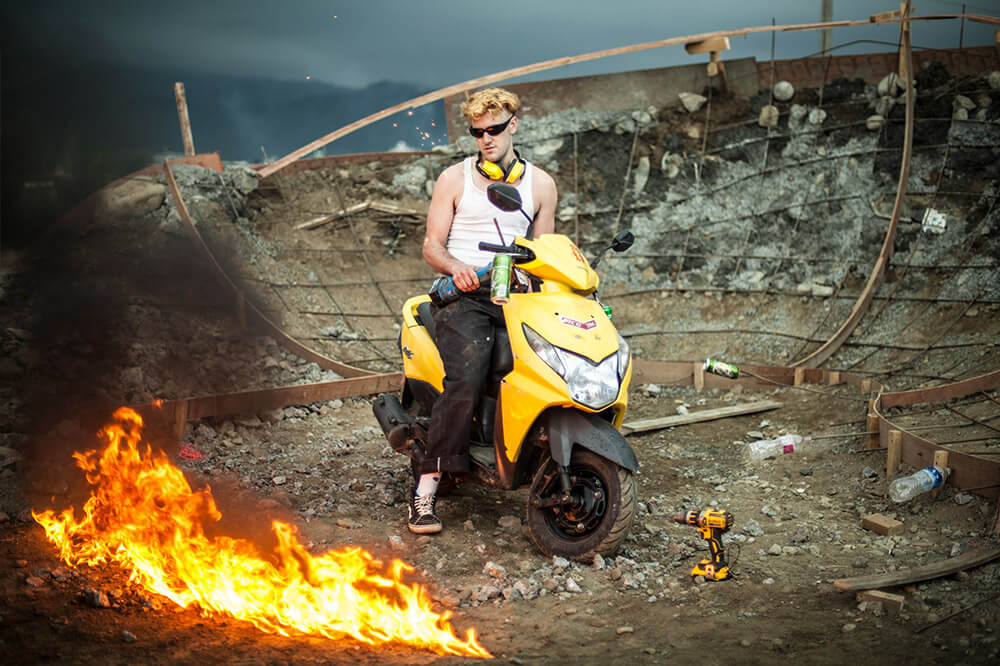 Skateboarders on a bike with fire in Nepal