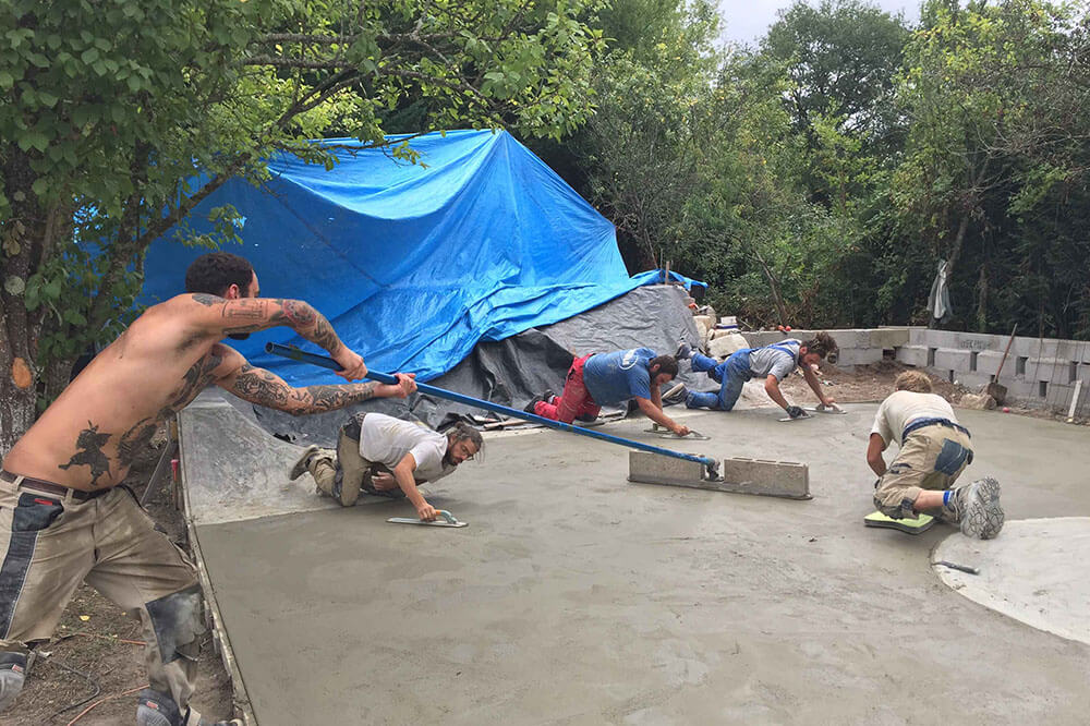 Crew of skateboarder building the DYI at Sathopia