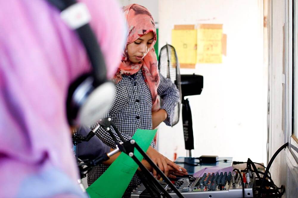 Girl doing radio in Jordan