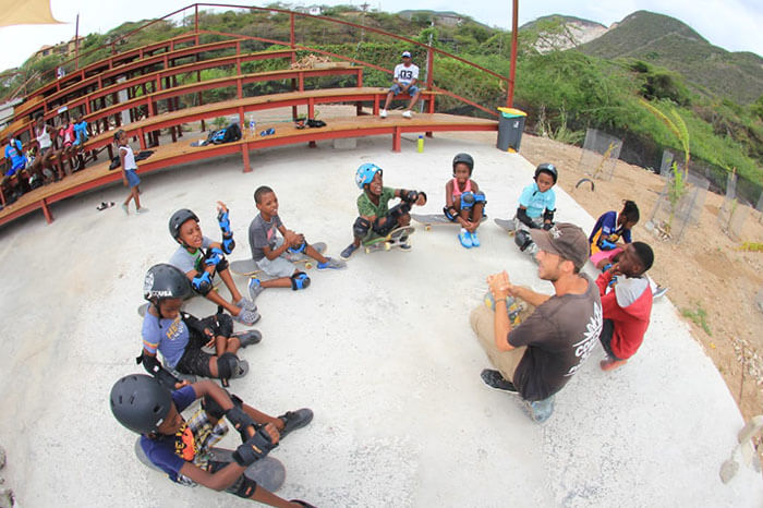 Tim van Asdonck teaching skateboarding in Jamaica